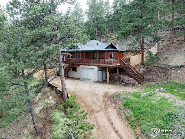 101 Spruce St, Jamestown, CO 80455 - view of front of home with stairway, driveway, an attached garage, and a deck