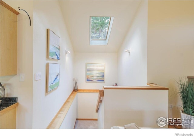101 Spruce St, Jamestown, CO 80455 - stairway featuring a skylight and vaulted ceiling
