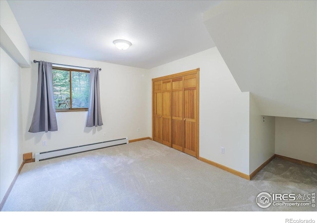 101 Spruce St, Jamestown, CO 80455 - unfurnished bedroom with a baseboard heating unit, carpet flooring, baseboards, and a closet