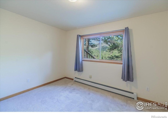 101 Spruce St, Jamestown, CO 80455 - empty room with a baseboard radiator, light colored carpet, and baseboards
