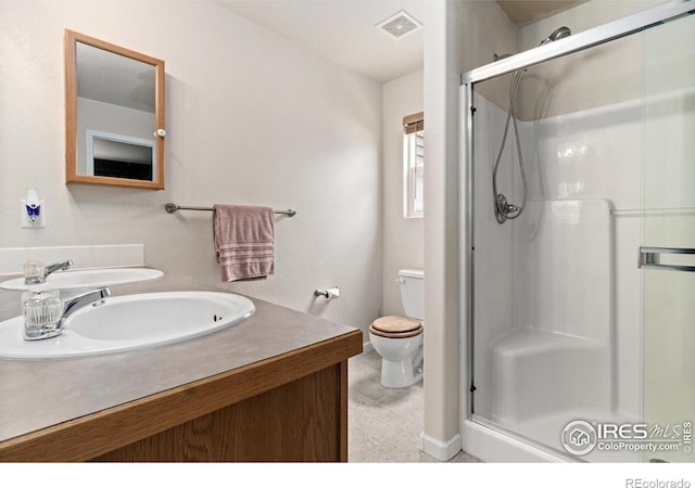 7037 Raleigh St, Wellington, CO 80549 - bathroom with baseboards, a stall shower, toilet, and vanity