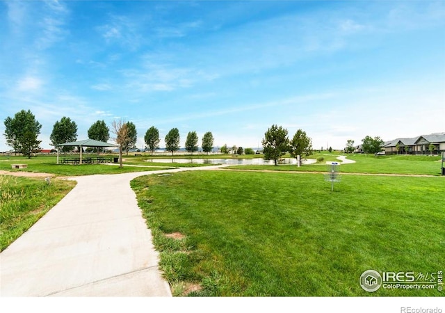 7037 Raleigh St, Wellington, CO 80549 - view of community featuring a gazebo, a yard, and a water view
