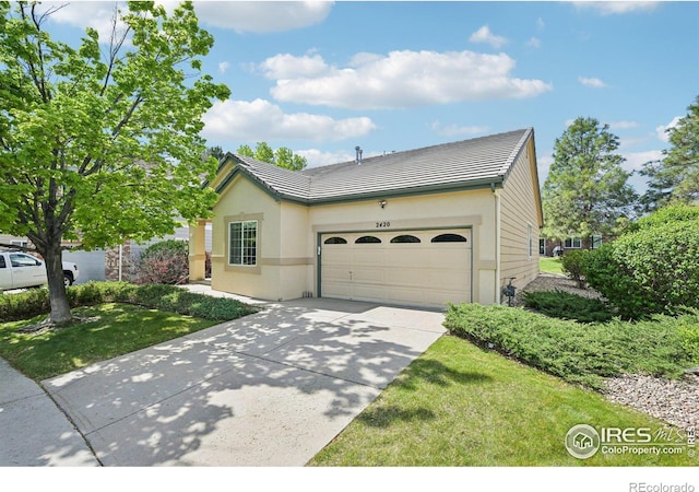 single story home with a garage, driveway, a tile roof, and stucco siding