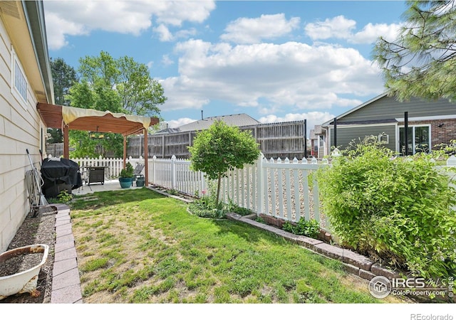 view of yard with a patio area and a pergola