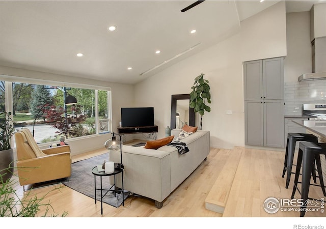 6862 Roaring Fork Trl, Boulder, CO 80301 - living room with recessed lighting, light wood finished floors, and high vaulted ceiling