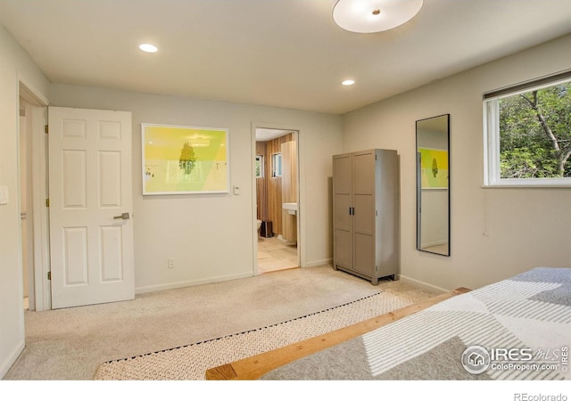 6862 Roaring Fork Trl, Boulder, CO 80301 - bedroom featuring recessed lighting, light colored carpet, connected bathroom, and baseboards