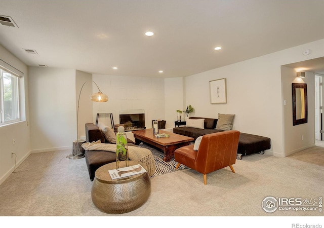 6862 Roaring Fork Trl, Boulder, CO 80301 - carpeted living area featuring recessed lighting, baseboards, and a tile fireplace