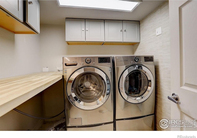 6862 Roaring Fork Trl, Boulder, CO 80301 - laundry room with cabinet space and washing machine and dryer