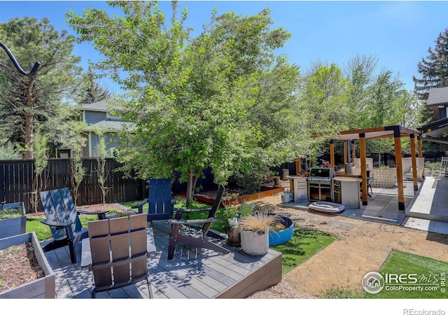 6862 Roaring Fork Trl, Boulder, CO 80301 - view of patio with a wooden deck and fence