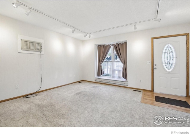 710 Sedge Way, Lafayette, CO 80026 - foyer with track lighting, carpet, and a wall mounted AC