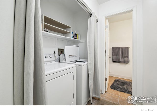 710 Sedge Way, Lafayette, CO 80026 - laundry room with independent washer and dryer and light tile patterned flooring