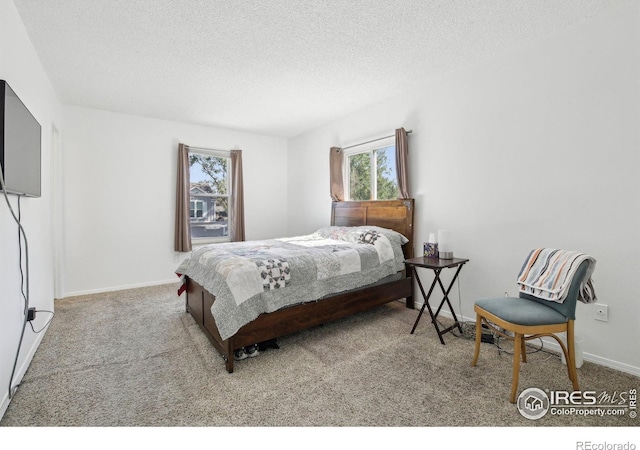 710 Sedge Way, Lafayette, CO 80026 - carpeted bedroom featuring multiple windows and a textured ceiling