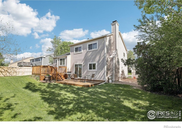 710 Sedge Way, Lafayette, CO 80026 - rear view of house featuring a chimney and a wooden deck