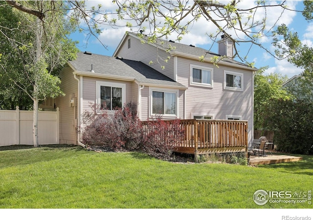 710 Sedge Way, Lafayette, CO 80026 - rear view of house with a deck, a chimney, and roof with shingles