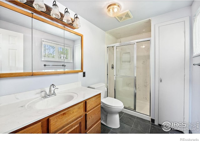 full bathroom with toilet, a stall shower, tile patterned flooring, and vanity