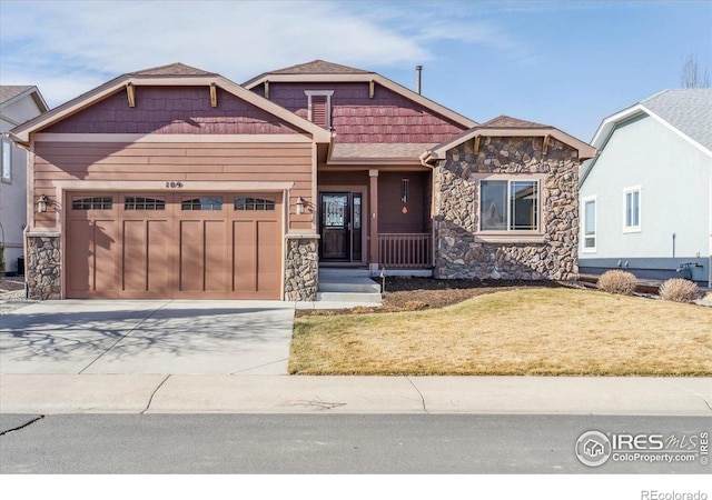 109 Veronica Dr, Windsor, CO 80550 - craftsman-style home with stone siding, a garage, driveway, a front lawn, and a porch