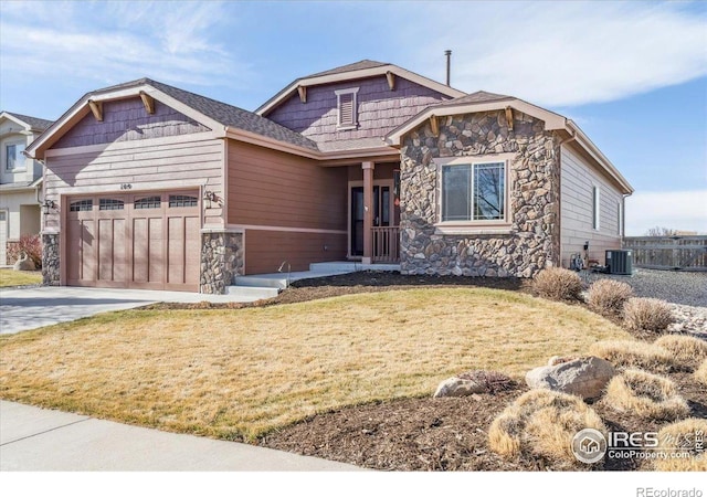 109 Veronica Dr, Windsor, CO 80550 - craftsman-style home with stone siding, a garage, central AC unit, and concrete driveway