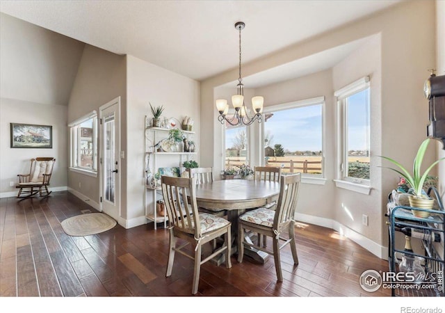 109 Veronica Dr, Windsor, CO 80550 - dining space with hardwood / wood-style flooring, a chandelier, and baseboards