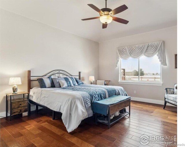 109 Veronica Dr, Windsor, CO 80550 - bedroom with wood finished floors, baseboards, and a ceiling fan