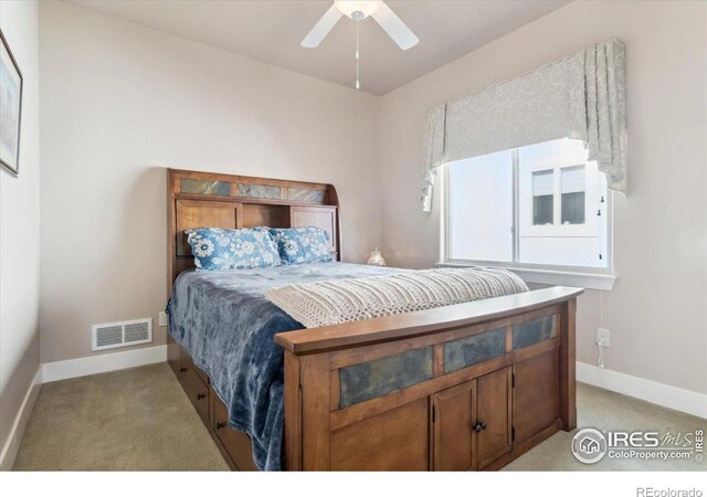 109 Veronica Dr, Windsor, CO 80550 - bedroom with light colored carpet, baseboards, and a ceiling fan