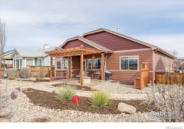 109 Veronica Dr, Windsor, CO 80550 - view of front of house with a pergola, a patio area, and fence