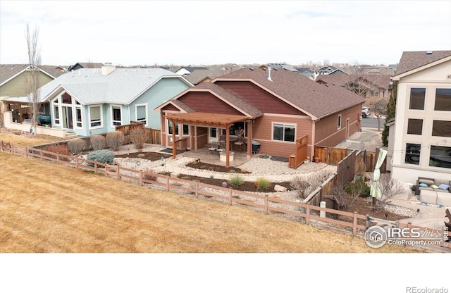 109 Veronica Dr, Windsor, CO 80550 - back of property with a patio area and a fenced backyard