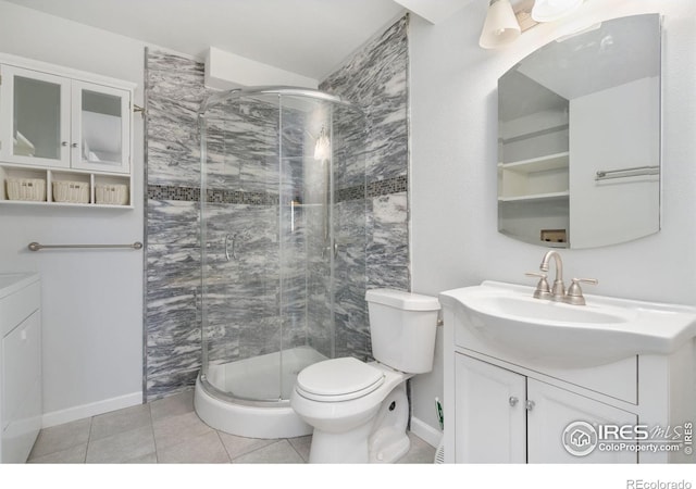 full bathroom featuring vanity, a stall shower, and baseboards