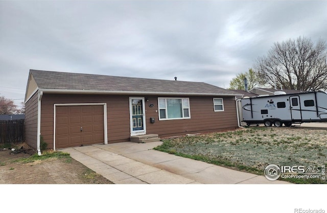 214 Charmony Pl, Sterling, CO 80751 - ranch-style house with a garage and concrete driveway
