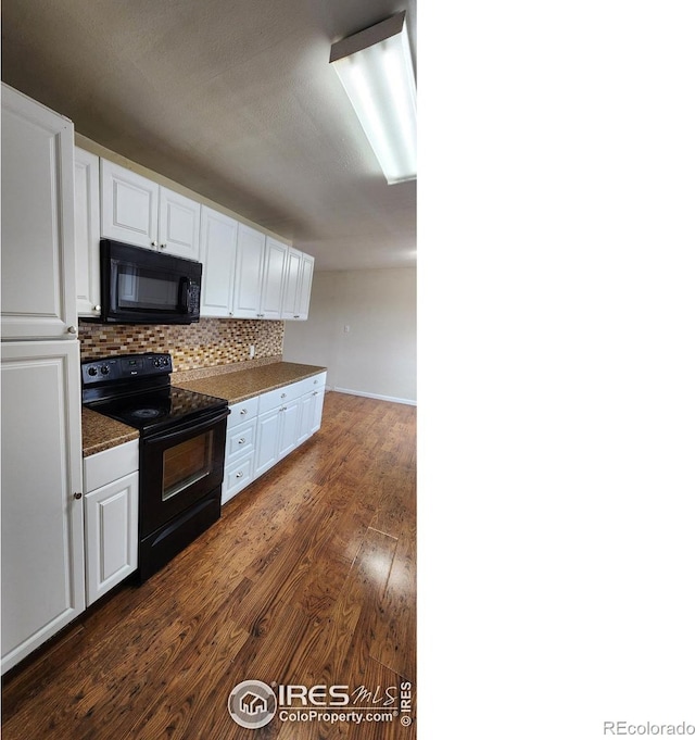 214 Charmony Pl, Sterling, CO 80751 - kitchen featuring black appliances, white cabinets, dark countertops, dark wood-type flooring, and backsplash