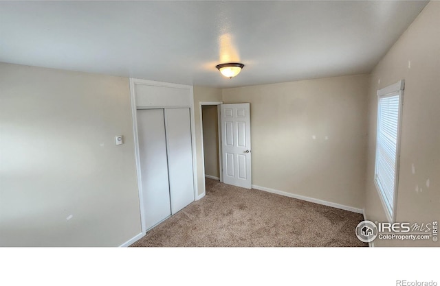 214 Charmony Pl, Sterling, CO 80751 - unfurnished bedroom featuring carpet flooring, a closet, and baseboards