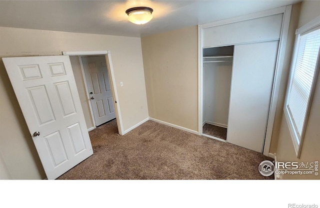 214 Charmony Pl, Sterling, CO 80751 - unfurnished bedroom featuring carpet flooring, a closet, and baseboards