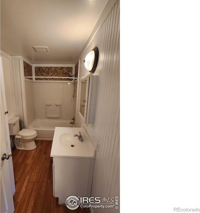 214 Charmony Pl, Sterling, CO 80751 - full bath featuring toilet, vanity, wood finished floors, and tub / shower combination
