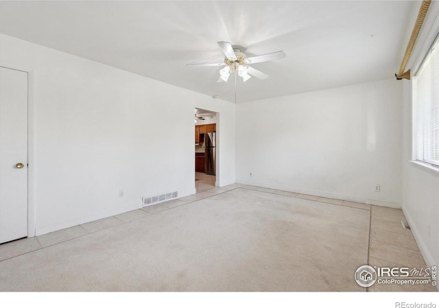 200 Perry St, Denver, CO 80219 - carpeted empty room featuring a ceiling fan and baseboards