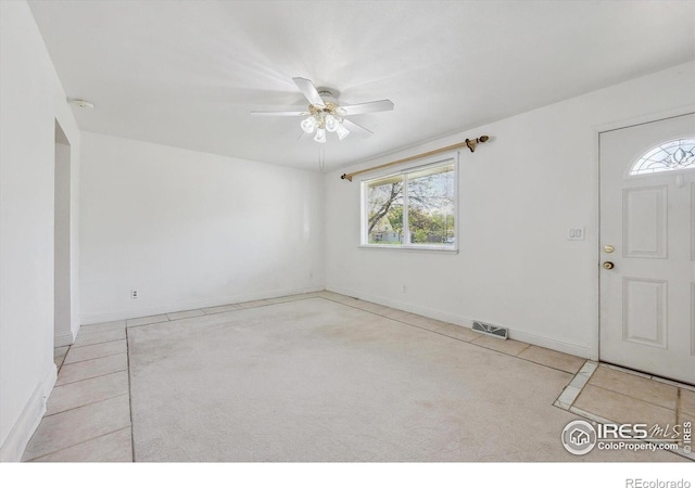 200 Perry St, Denver, CO 80219 - foyer entrance featuring healthy amount of natural light, ceiling fan, and baseboards