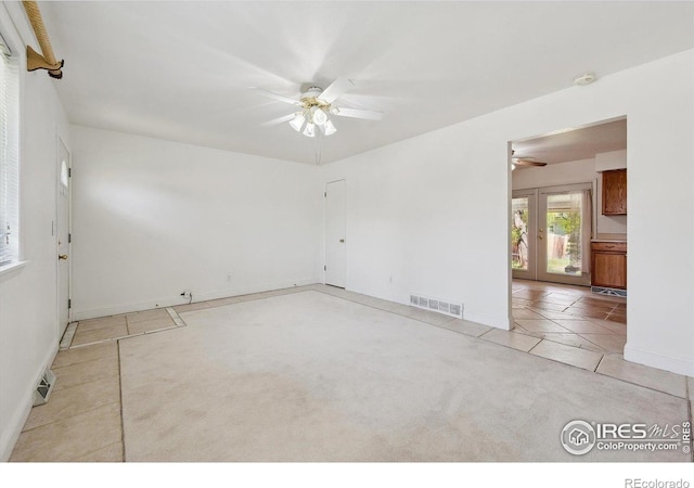 200 Perry St, Denver, CO 80219 - unfurnished room with ceiling fan, light tile patterned flooring, french doors, and baseboards