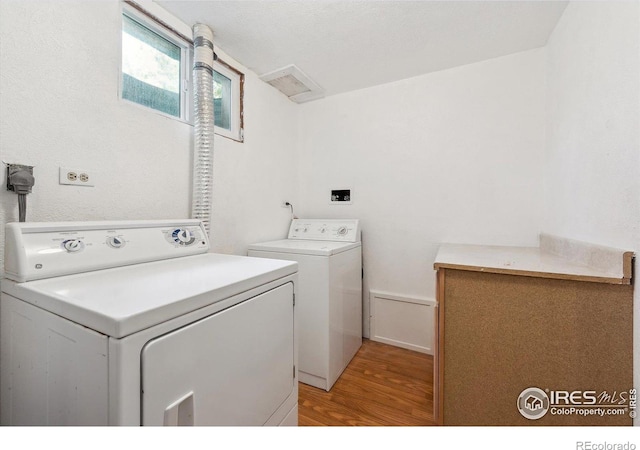 200 Perry St, Denver, CO 80219 - laundry room featuring separate washer and dryer and light wood-style flooring