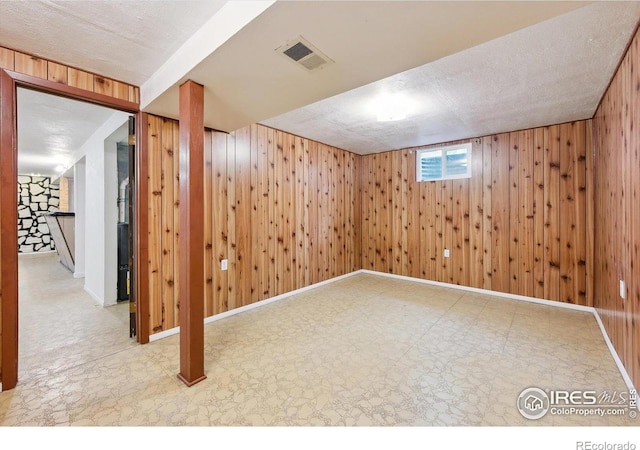 200 Perry St, Denver, CO 80219 - basement with wooden walls and tile patterned floors