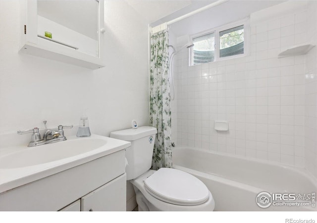 200 Perry St, Denver, CO 80219 - full bathroom featuring toilet, shower / bath combo, and vanity