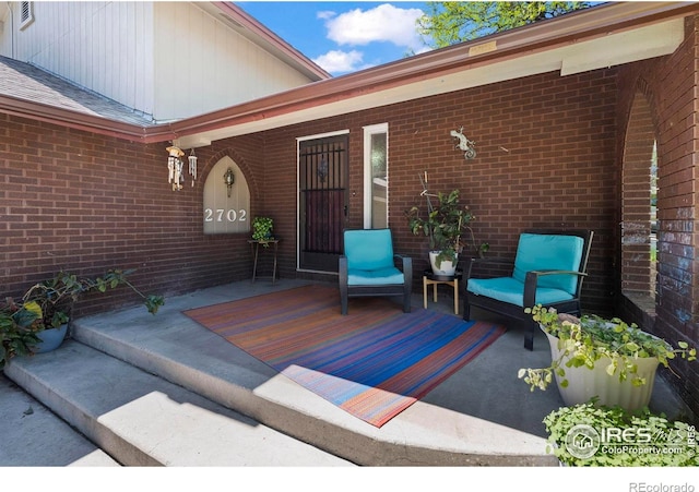 2702 W 23rd St, Greeley, CO 80634 - view of exterior entry featuring brick siding