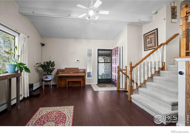 2702 W 23rd St, Greeley, CO 80634 - foyer with wood finished floors, ceiling fan, stairway, and baseboards