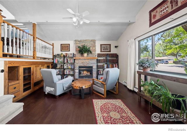 2702 W 23rd St, Greeley, CO 80634 - living room with a stone fireplace, wood finished floors, and ceiling fan