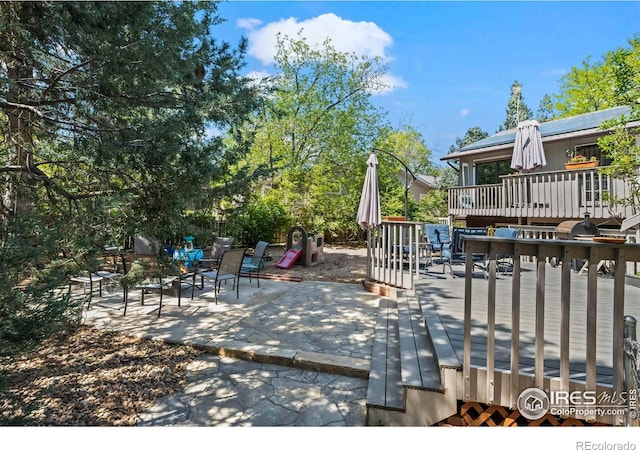 2702 W 23rd St, Greeley, CO 80634 - view of patio featuring a deck