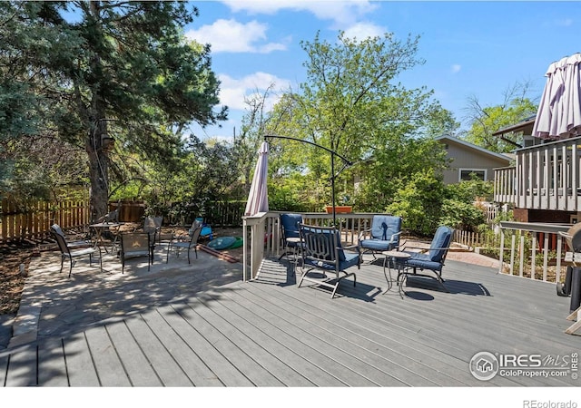2702 W 23rd St, Greeley, CO 80634 - wooden deck with a fenced backyard and outdoor dining space