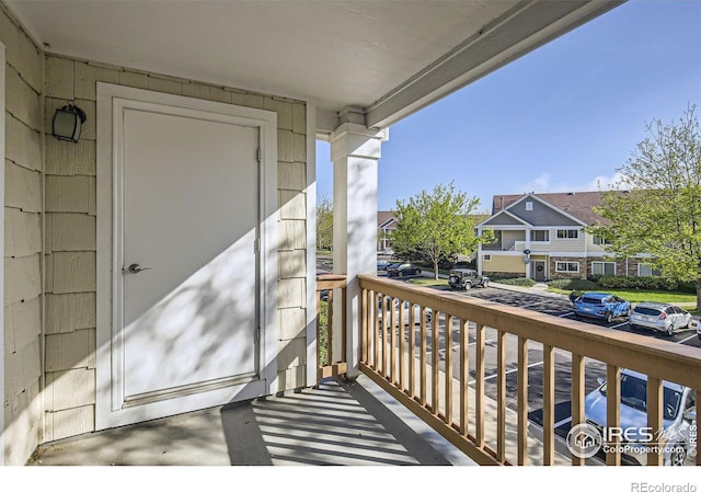 balcony with covered porch and a residential view