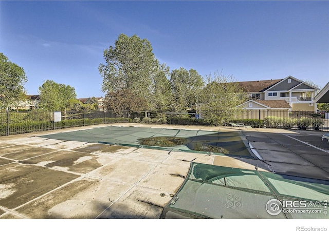 view of pool featuring a patio area and fence