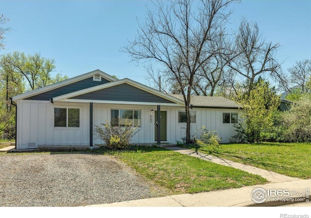 3100 Denton Ave, Boulder, CO 80303 - view of front of property featuring board and batten siding and a front lawn