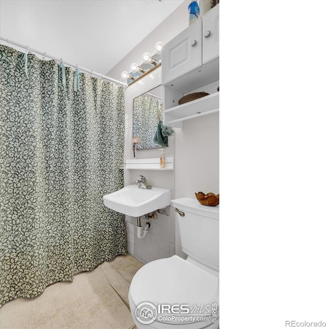 3100 Denton Ave, Boulder, CO 80303 - full bathroom featuring toilet and curtained shower