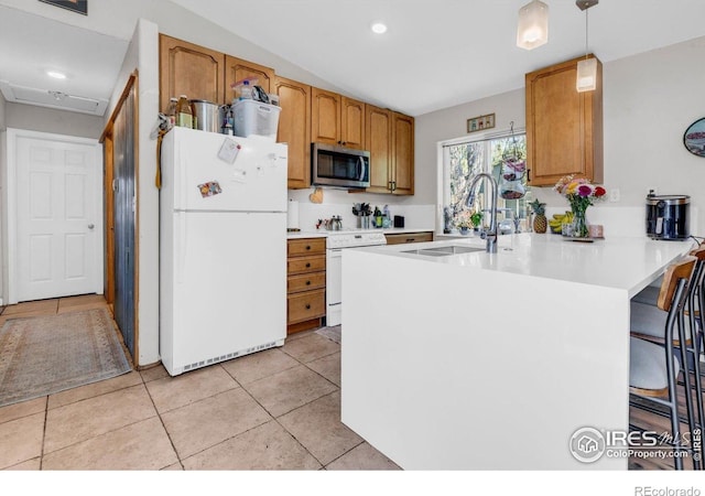 3100 Denton Ave, Boulder, CO 80303 - kitchen featuring white appliances, a sink, a peninsula, light countertops, and light tile patterned floors