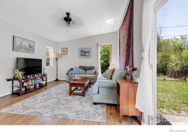 3100 Denton Ave, Boulder, CO 80303 - living room with healthy amount of natural light, a ceiling fan, lofted ceiling, wood finished floors, and baseboards