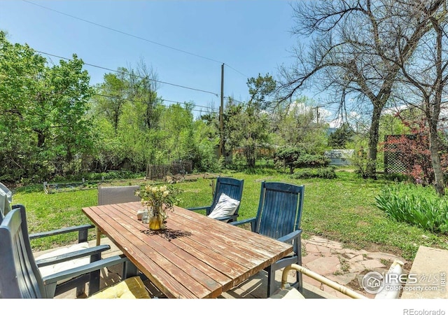 3100 Denton Ave, Boulder, CO 80303 - view of patio / terrace featuring outdoor dining space and view of wooded area
